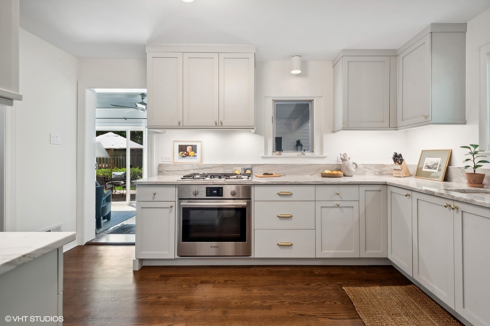2044 Ewing Avenue Evanston, IL 60201 - Photo 14 of 35 a kitchen with stainless steel appliances granite countertop a stove a sink and a microwave