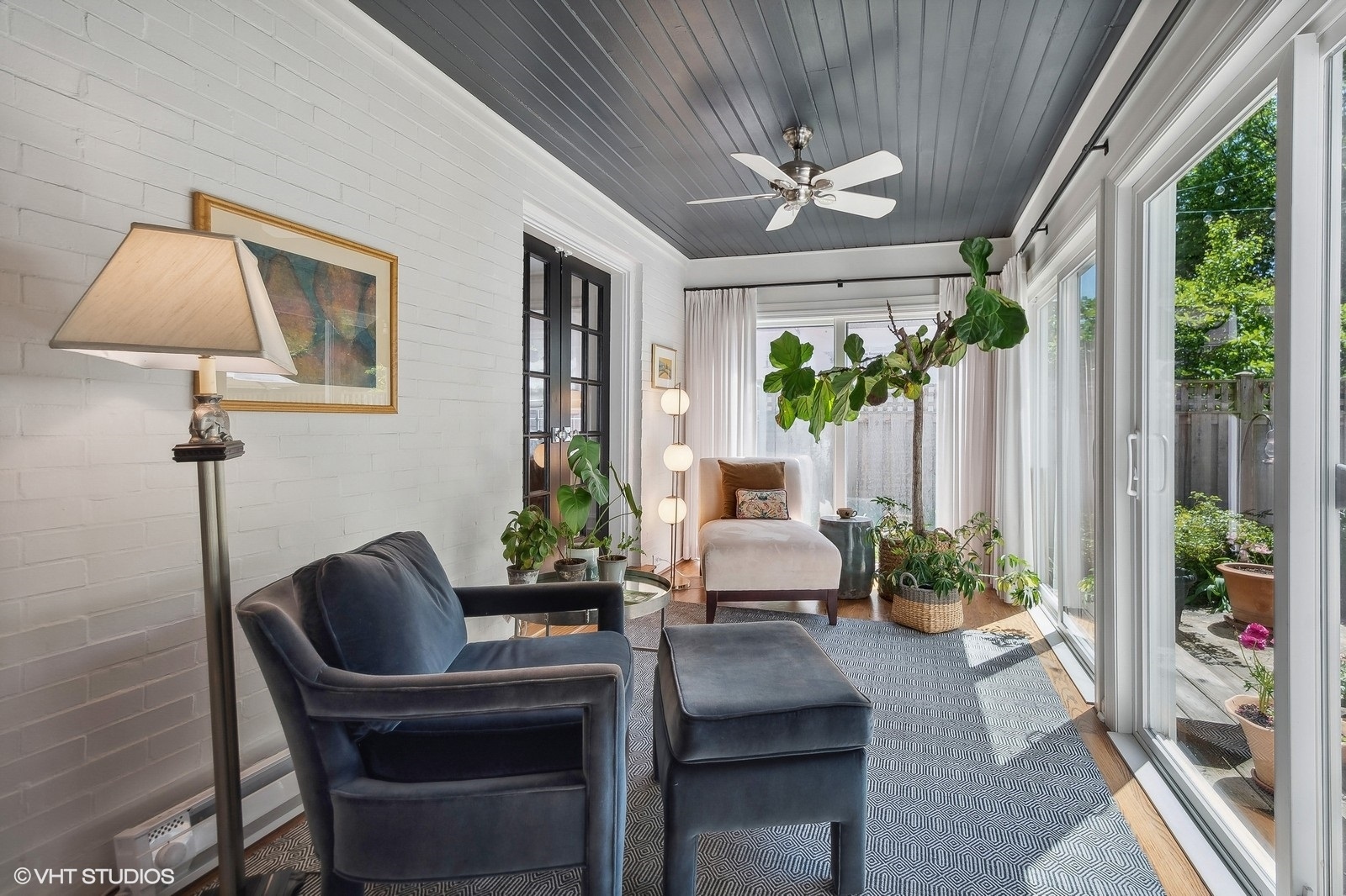 2044 Ewing Avenue Evanston, IL 60201 - Photo 16 of 35 a living room with furniture and a chandelier
