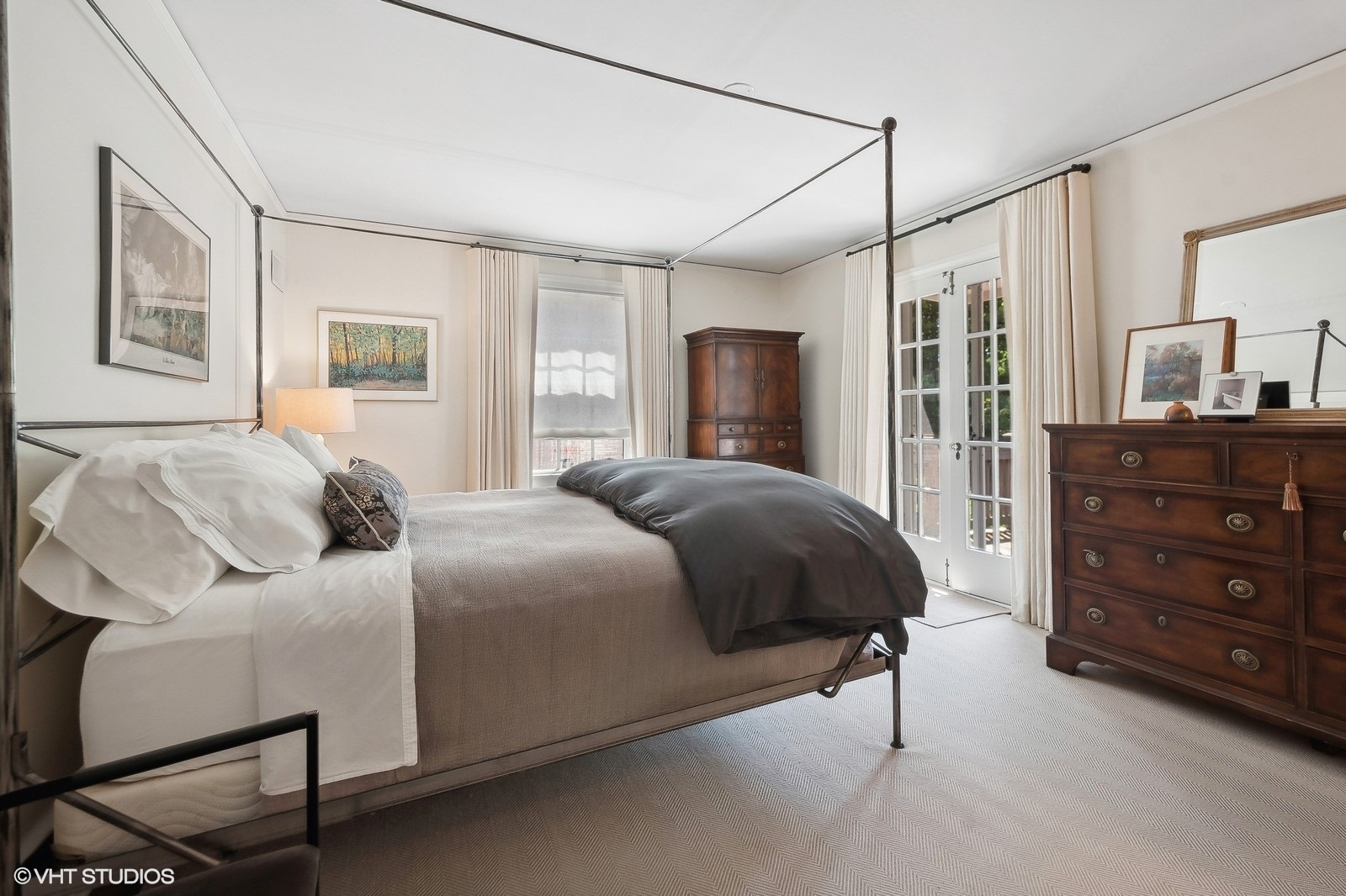 2044 Ewing Avenue Evanston, IL 60201 - Photo 19 of 35 a bedroom with a bed a dresser and painting on the wall