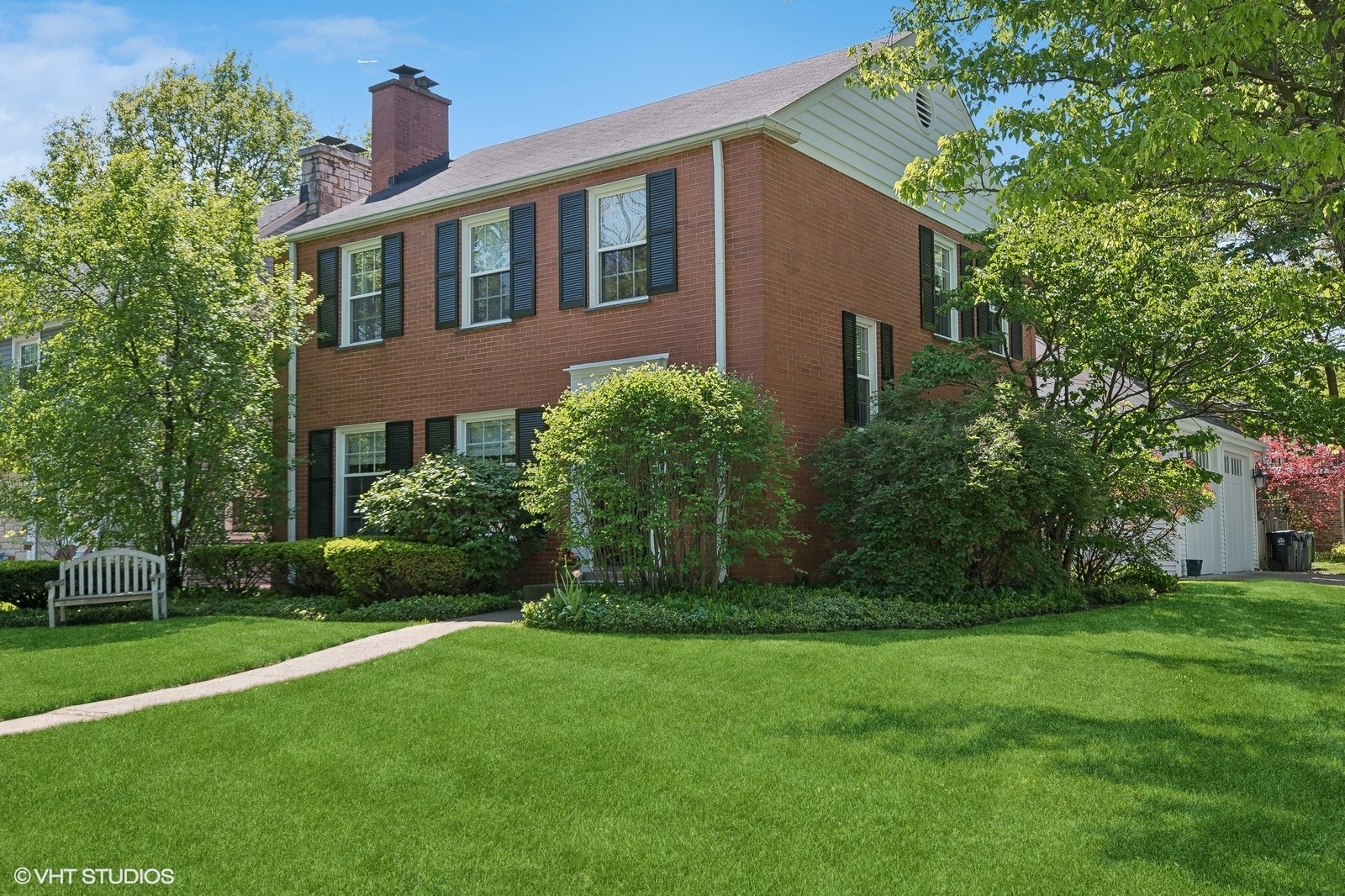 2044 Ewing Avenue Evanston, IL 60201 - Photo 2 of 35 a front view of a house with garden