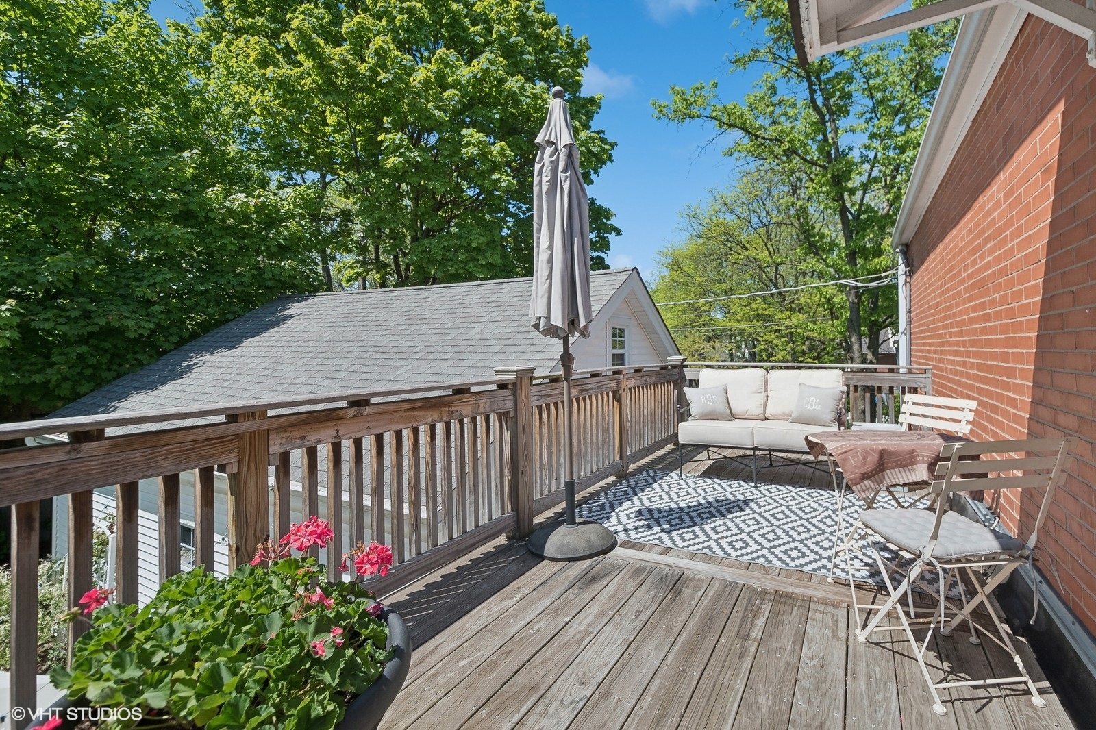 2044 Ewing Avenue Evanston, IL 60201 - Photo 21 of 35 a view of balcony with wooden floor and outdoor seating