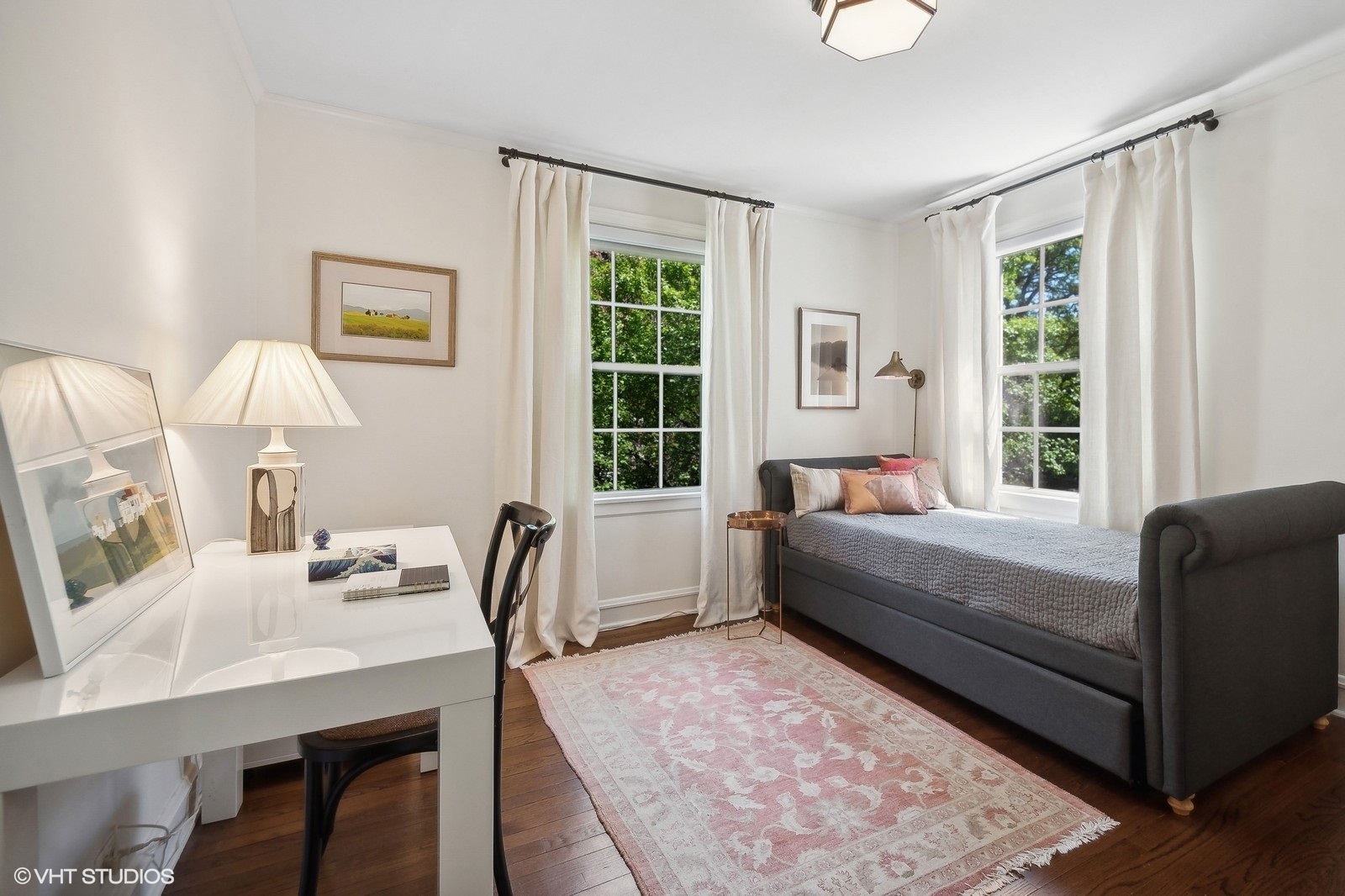 2044 Ewing Avenue Evanston, IL 60201 - Photo 23 of 35 a bedroom with a bed table chair and a window