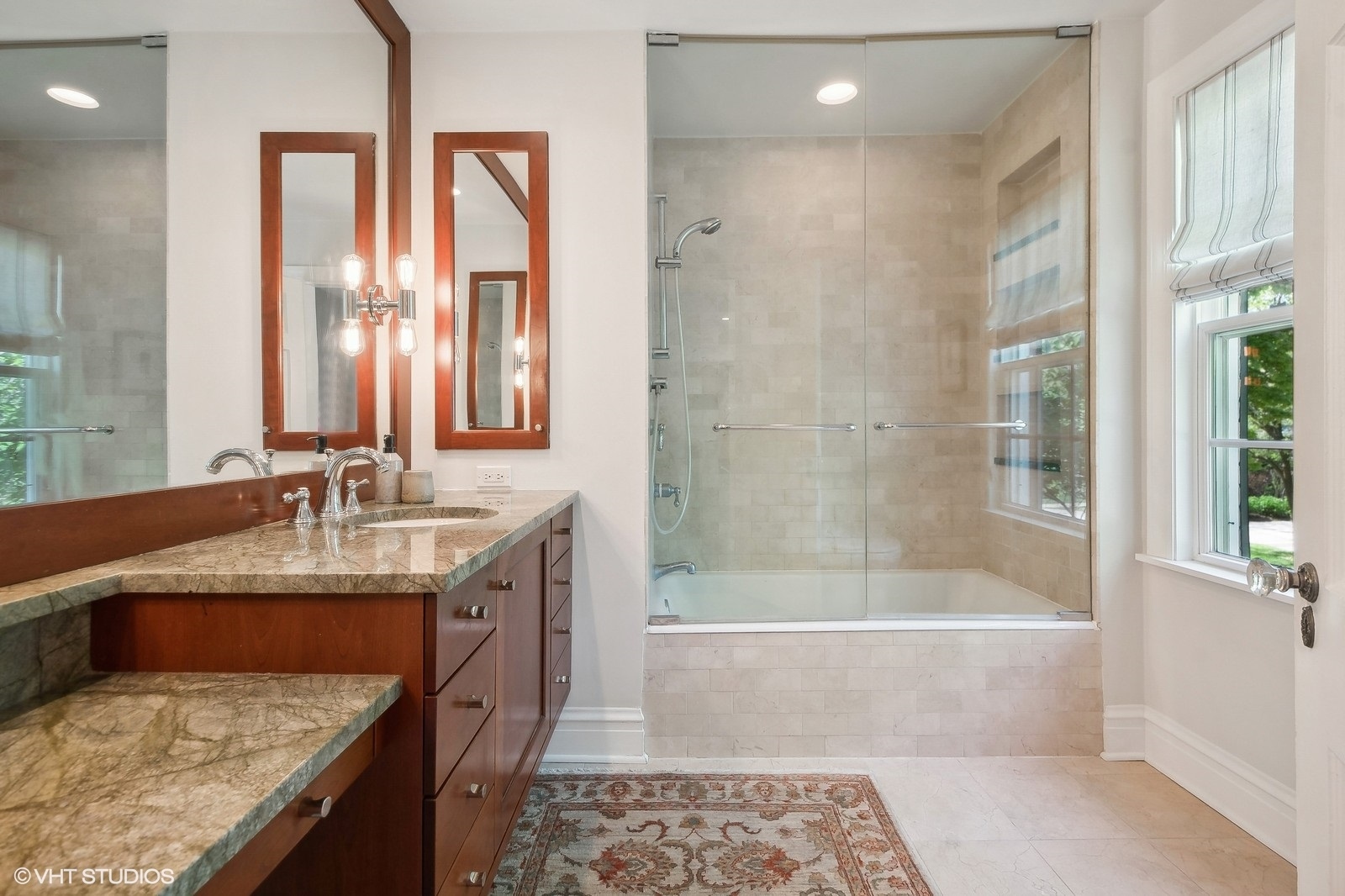 2044 Ewing Avenue Evanston, IL 60201 - Photo 24 of 35 a bathroom with a granite countertop tub sink and mirror