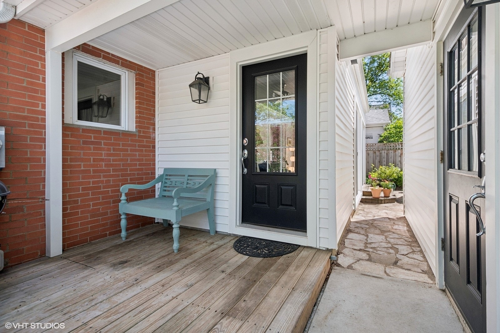 2044 Ewing Avenue Evanston, IL 60201 - Photo 27 of 35 a view of a porch with wooden floor and floor to ceiling window
