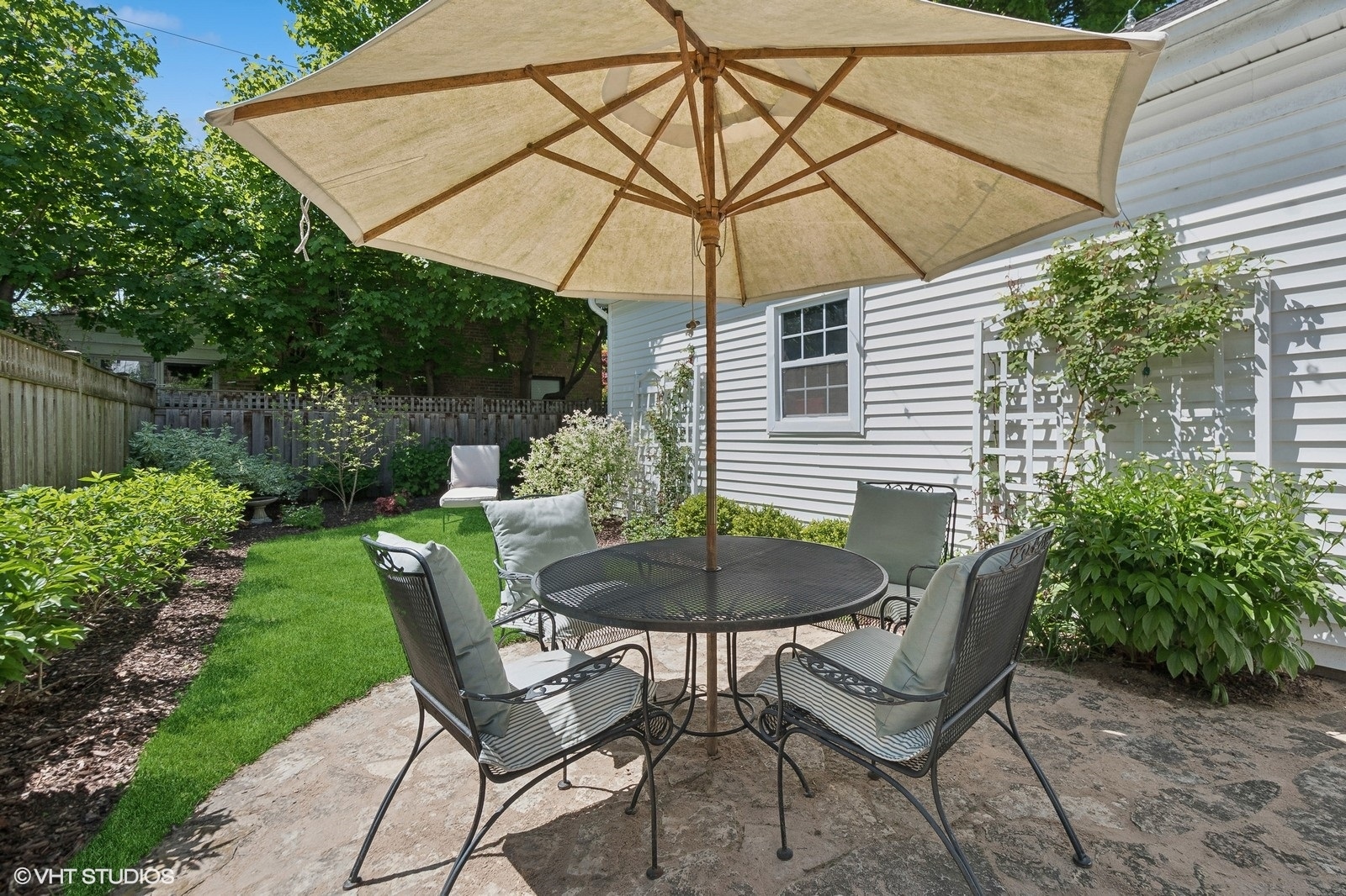2044 Ewing Avenue Evanston, IL 60201 - Photo 30 of 35 a view of a chair and table under an umbrella