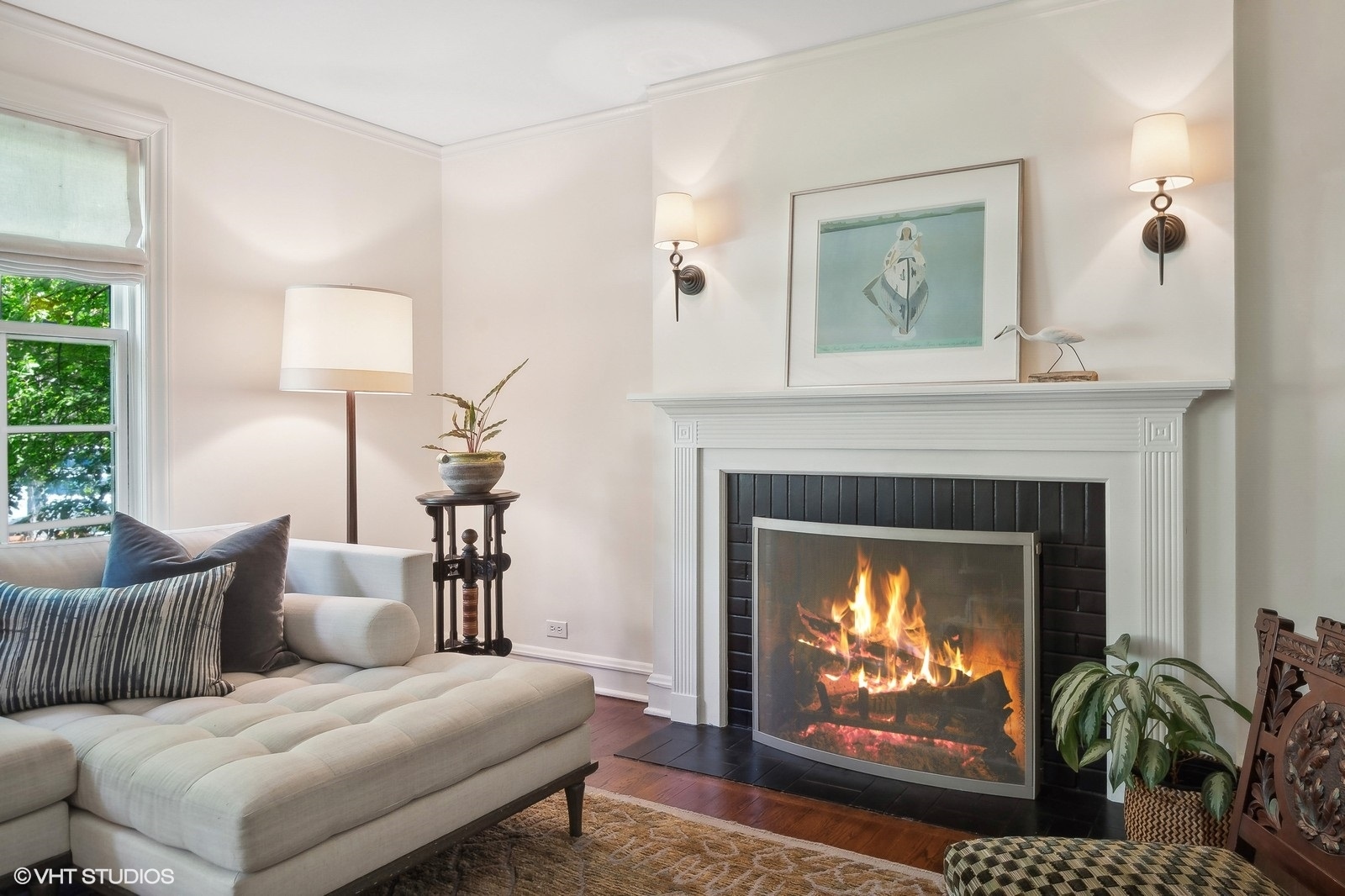 2044 Ewing Avenue Evanston, IL 60201 - Photo 7 of 35 a living room with furniture a fireplace and a flat screen tv