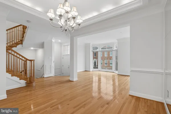 a kitchen with stainless steel appliances granite countertop a refrigerator a sink and a stove