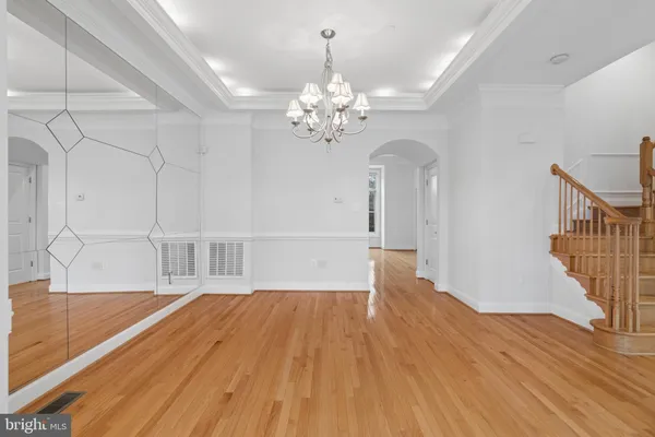 a view of entryway with wooden floor