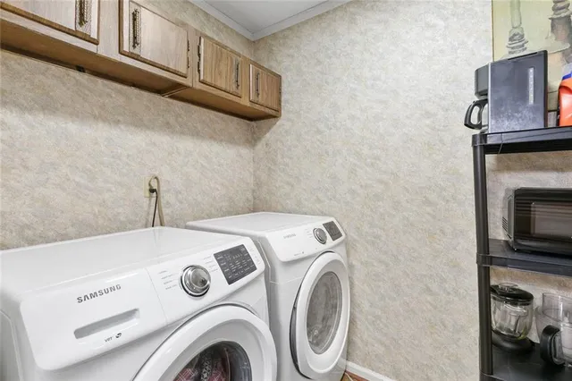 a utility room with dryer and washer