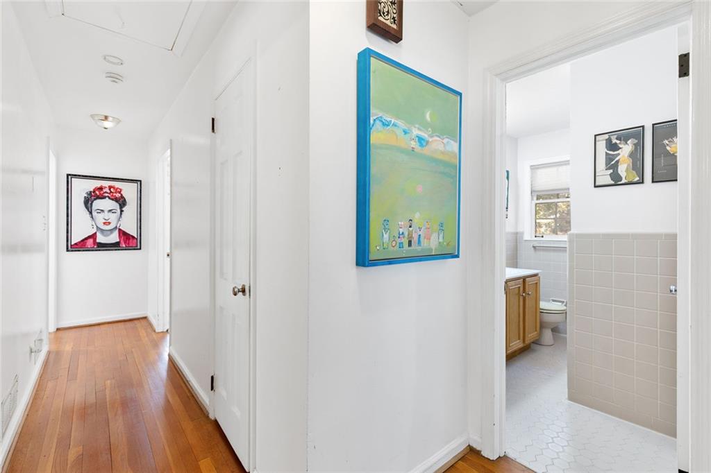 2258 Greencrest Drive Northeast Atlanta, GA 30345 - Photo 16 of 39 a view of hallway with wooden floor and stairs