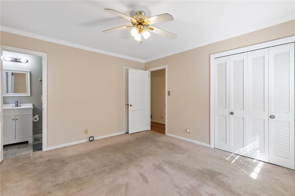 2258 Greencrest Drive Northeast Atlanta, GA 30345 - Photo 20 of 39 an empty room with closet and a chandelier fan