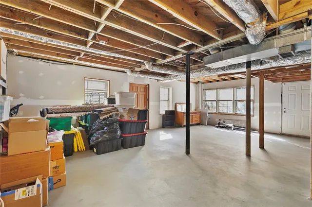 a view of a livingroom with furniture and a window