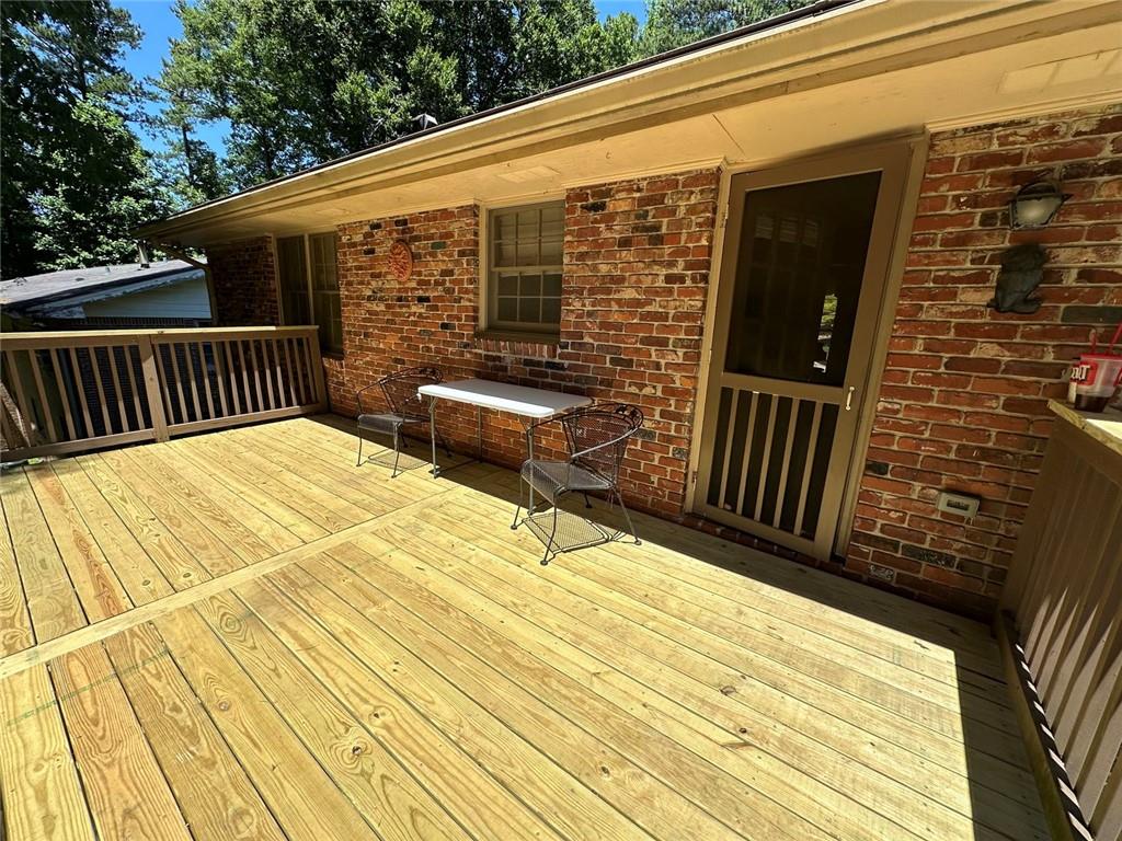 2258 Greencrest Drive Northeast Atlanta, GA 30345 - Photo 32 of 39 a backyard of a house with wooden floor and fence