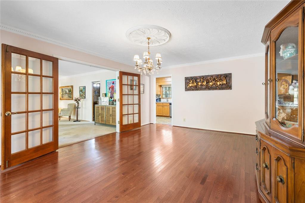 2258 Greencrest Drive Northeast Atlanta, GA 30345 - Photo 6 of 39 wooden floor in an empty room with a window