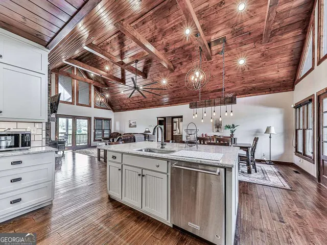 a view of a kitchen with furniture and fireplace