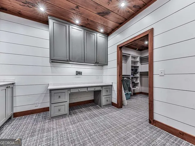 an outdoor sitting area with lake view