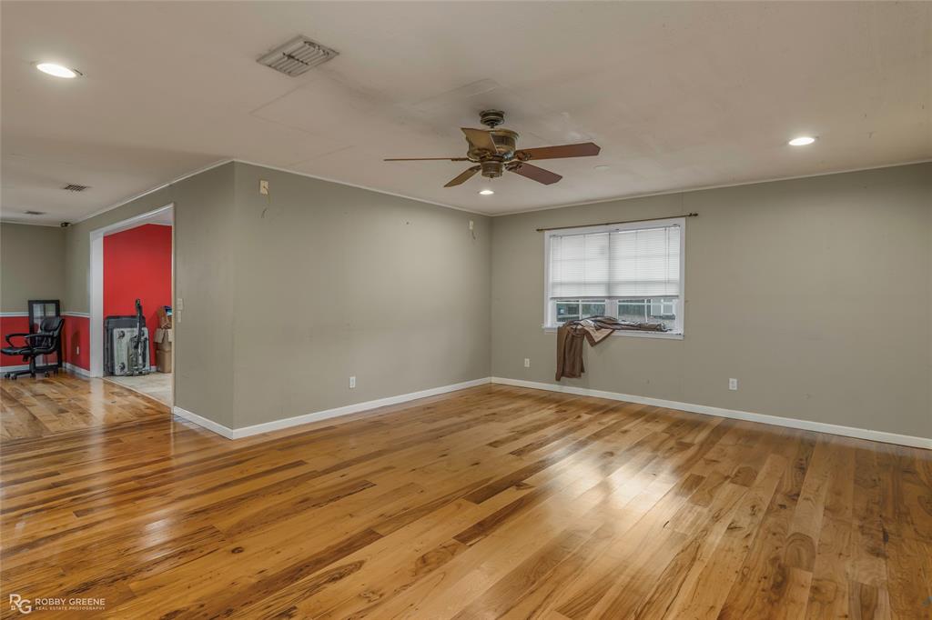 158 Edwards Road Doyline, LA 71023 - Photo 11 of 28 a view of empty room with wooden floor and fan