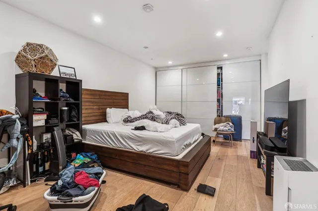 a kitchen view of a counter top space a sink stainless steel appliances and cabinets