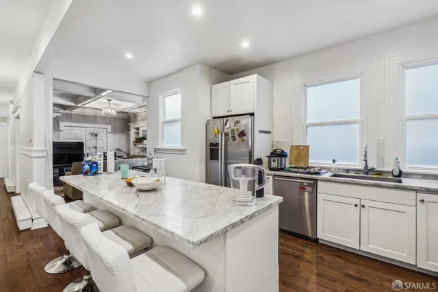 a bathroom with a sink vanity and mirror