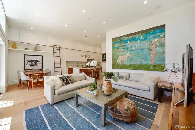 a bedroom with bed and wooden floor