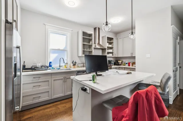 a living room with fireplace furniture and a chandelier