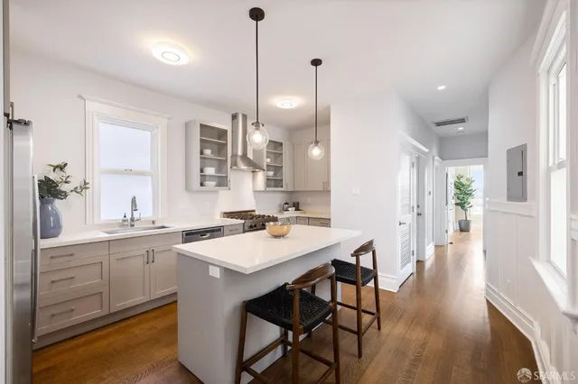 a view of a livingroom with furniture and a fireplace