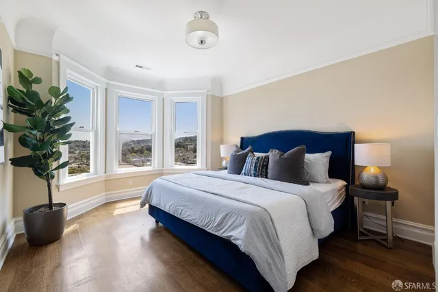 a kitchen with stainless steel appliances a stove a sink refrigerator and a wooden cabinets