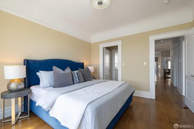 a kitchen with stainless steel appliances kitchen island granite countertop a sink a stove and cabinets