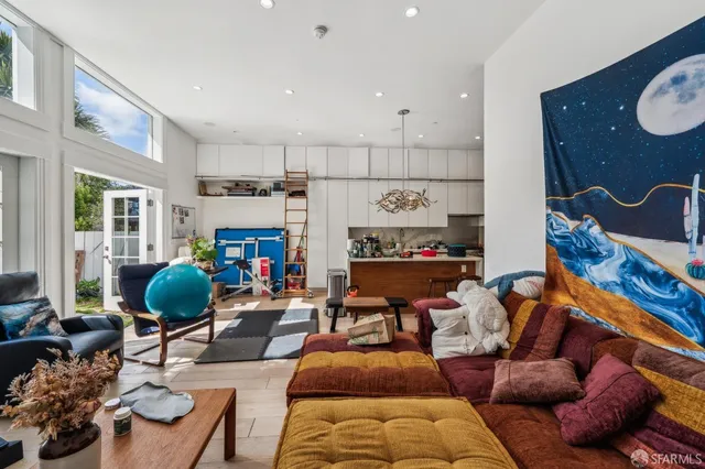 a en suite bathroom with a granite countertop sink and a mirror