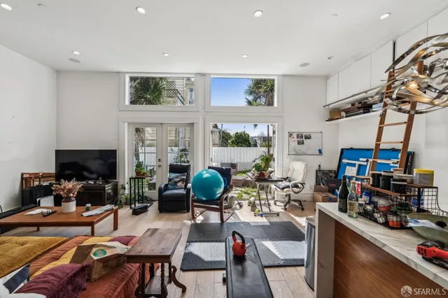 a bathroom with a granite countertop sink a bathtub and next to a window