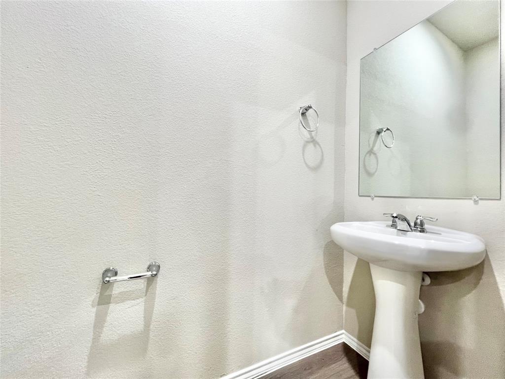 3501 East Renfro Street, Unit 120 Burleson, TX 76028 - Photo 11 of 30 a bathroom with a sink and mirror