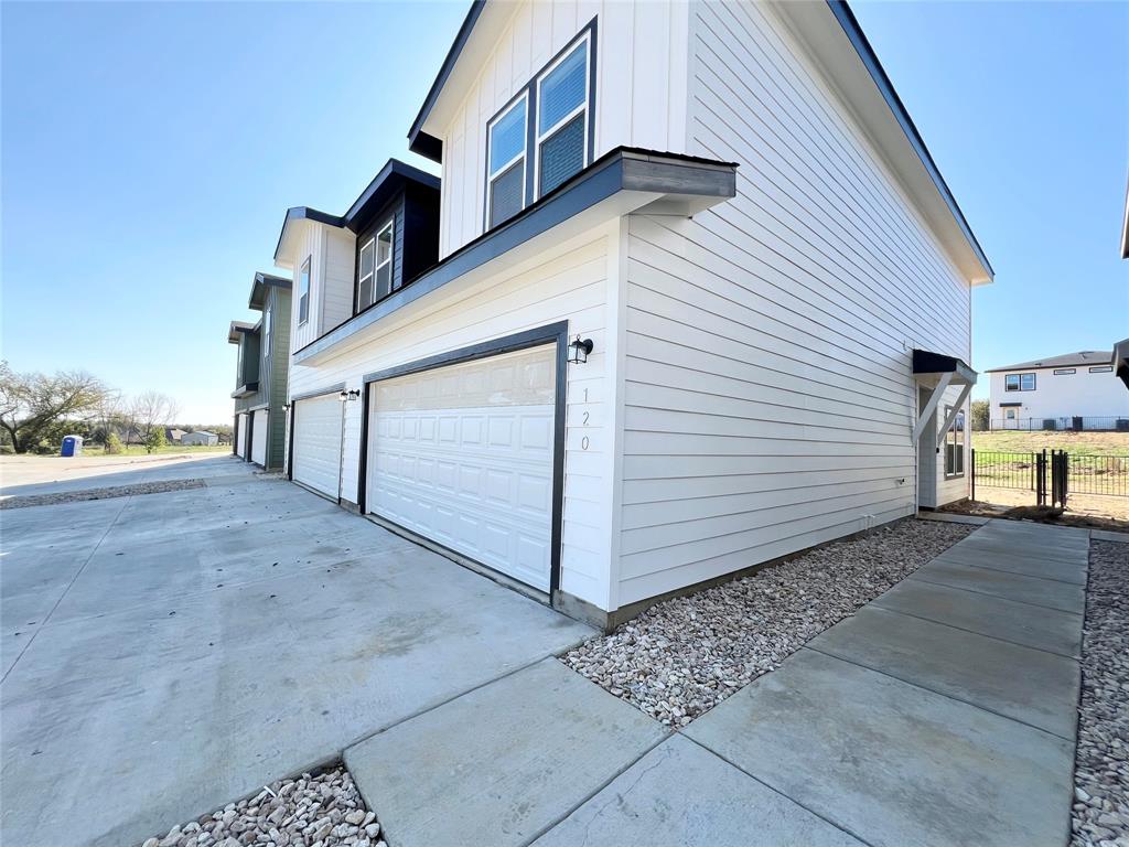 3501 East Renfro Street, Unit 120 Burleson, TX 76028 - Photo 2 of 30 a view of a house with a yard