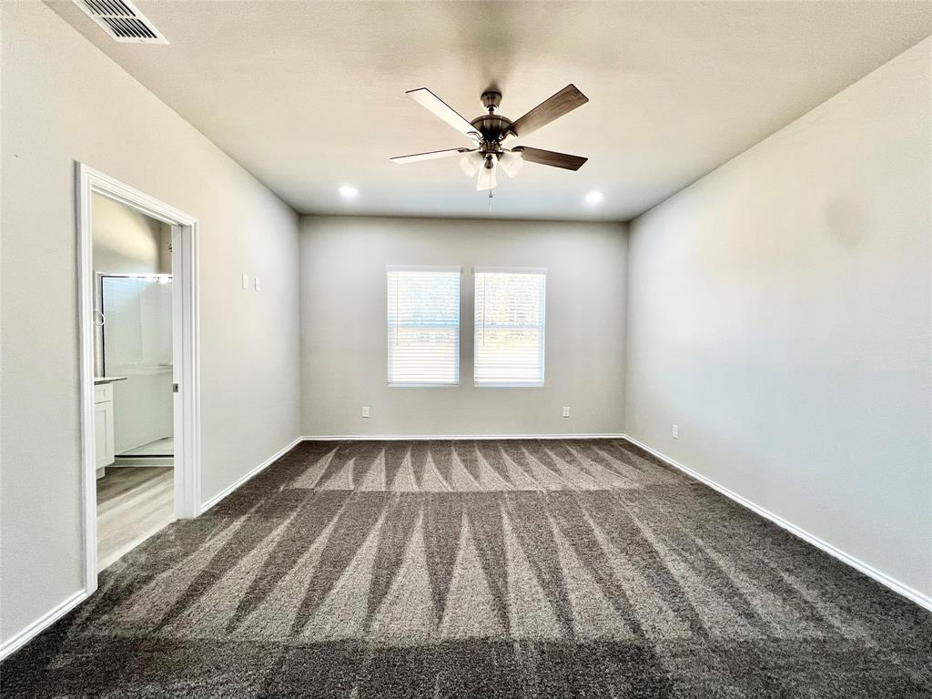 3501 East Renfro Street, Unit 120 Burleson, TX 76028 - Photo 22 of 30 a view of an empty room with wooden floor and a window