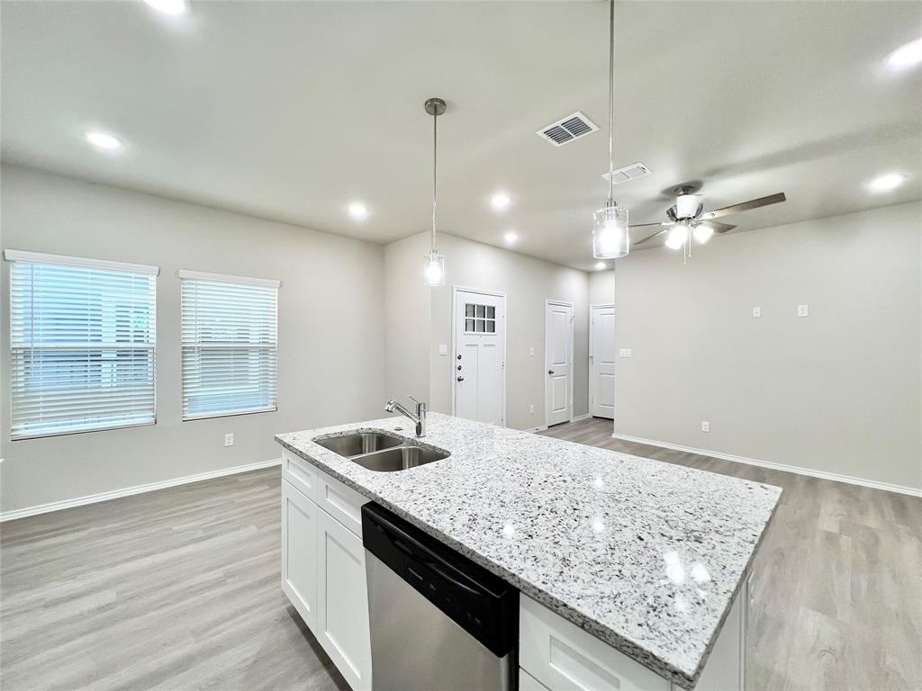 3501 East Renfro Street, Unit 120 Burleson, TX 76028 - Photo 8 of 30 a bathroom with a granite countertop sink and a mirror