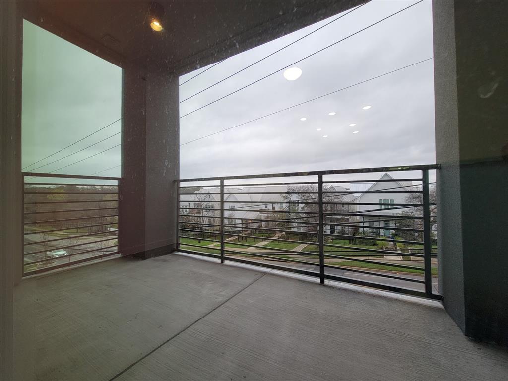 4801 Springdale Road, Unit 2211 Austin, TX 78723 - Photo 16 of 19 An inviting private outdoor patio offers serene views of the surrounding neighborhood.