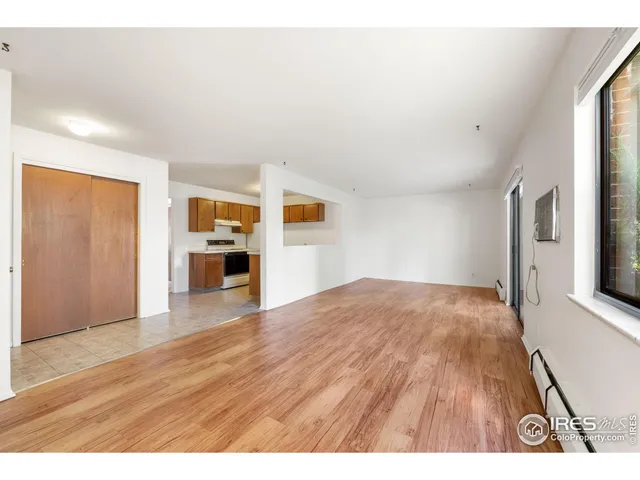 a view of a livingroom with wooden floor