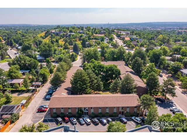 an aerial view of a house with a garden