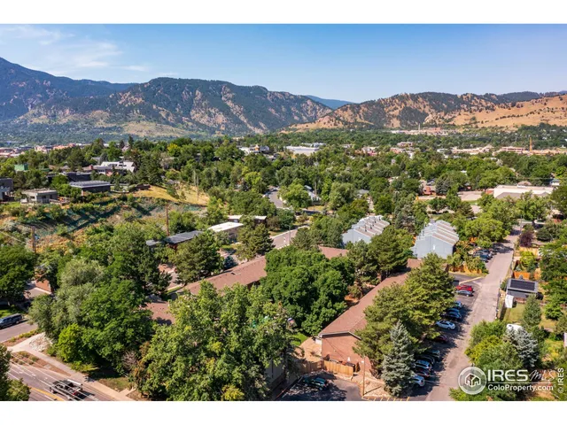 a view of a city with mountains in the background