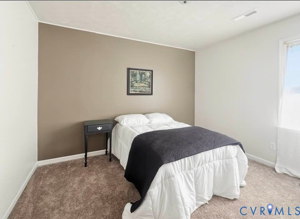 6009 Simplicity Court Chesterfield, VA 23832 - Photo 12 of 22 a bedroom with a bed and a wall painting