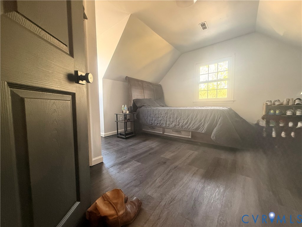 6009 Simplicity Court Chesterfield, VA 23832 - Photo 17 of 22 a view of livingroom and bedroom with wooden floor