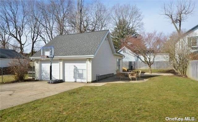 31 Highland Court Huntington, NY 11743 - Photo 11 of 12 a view of a house with backyard and sitting area