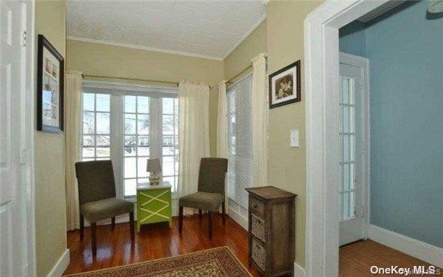 31 Highland Court Huntington, NY 11743 - Photo 2 of 12 a living room with furniture and a window