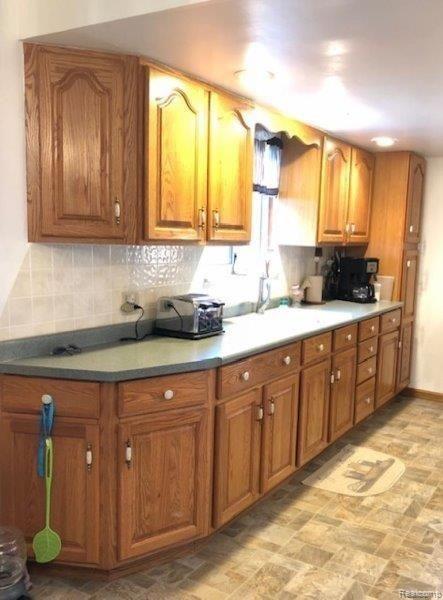 3961 Washburn Road Vassar, MI 48768 - Photo 10 of 25 The kitchen has newer cabinets with a pantry cabinet.