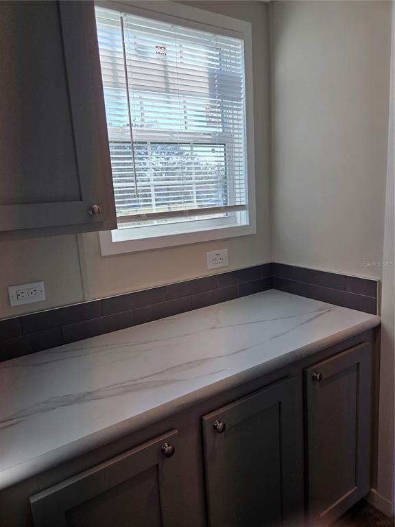 4901 North Vaughn Road Plant City, FL 33565 - Photo 11 of 31 a view of a kitchen with a window