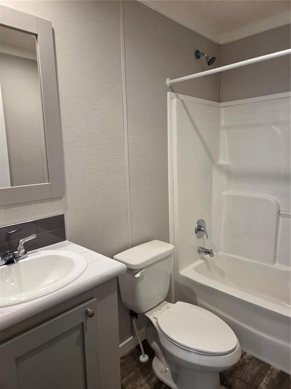 4901 North Vaughn Road Plant City, FL 33565 - Photo 16 of 31 a white toilet sitting next to a bathroom sink