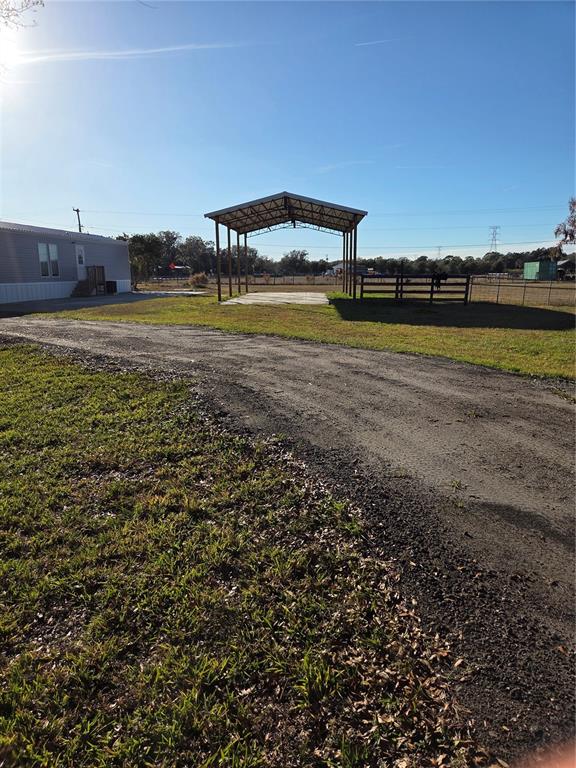 4901 North Vaughn Road Plant City, FL 33565 - Photo 2 of 31 a view of a swimming pool with an ocean view