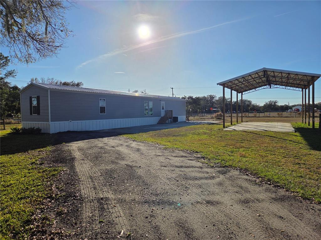 4901 North Vaughn Road Plant City, FL 33565 - Photo 4 of 31 a view of a room with a table and chairs
