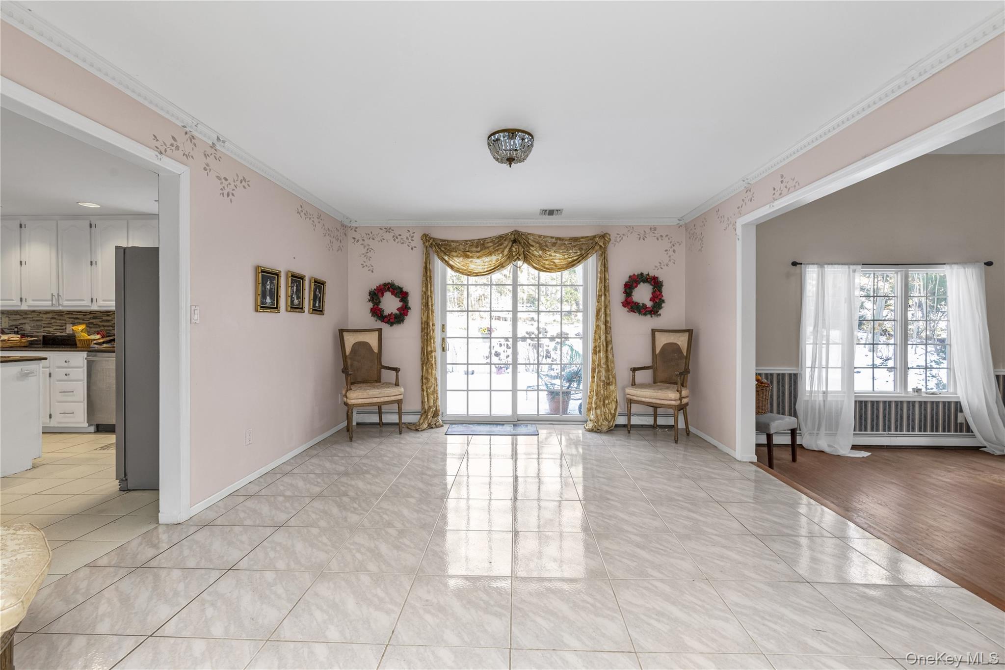 39 Fleets Cove Road Huntington, NY 11743 - Photo 2 of 20 Sitting room featuring ornamental molding and light tile patterned floors
