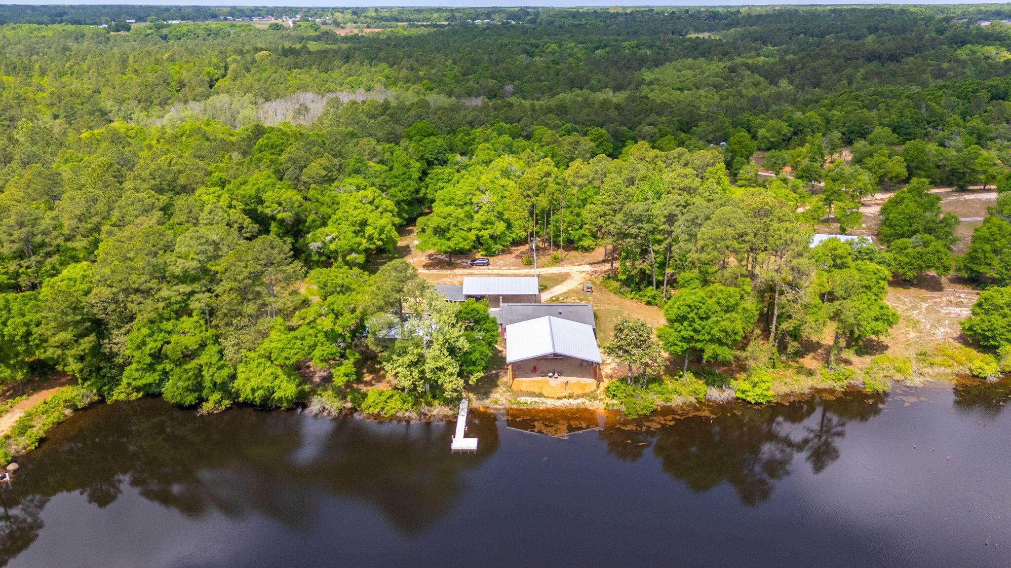 5371 Hilton Road North Baker, FL 32531 - Photo 8 of 11 a view of a lake with a house