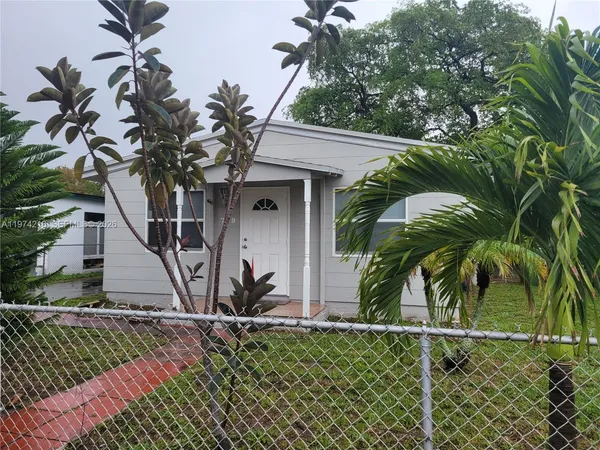 a view of a house with a tree
